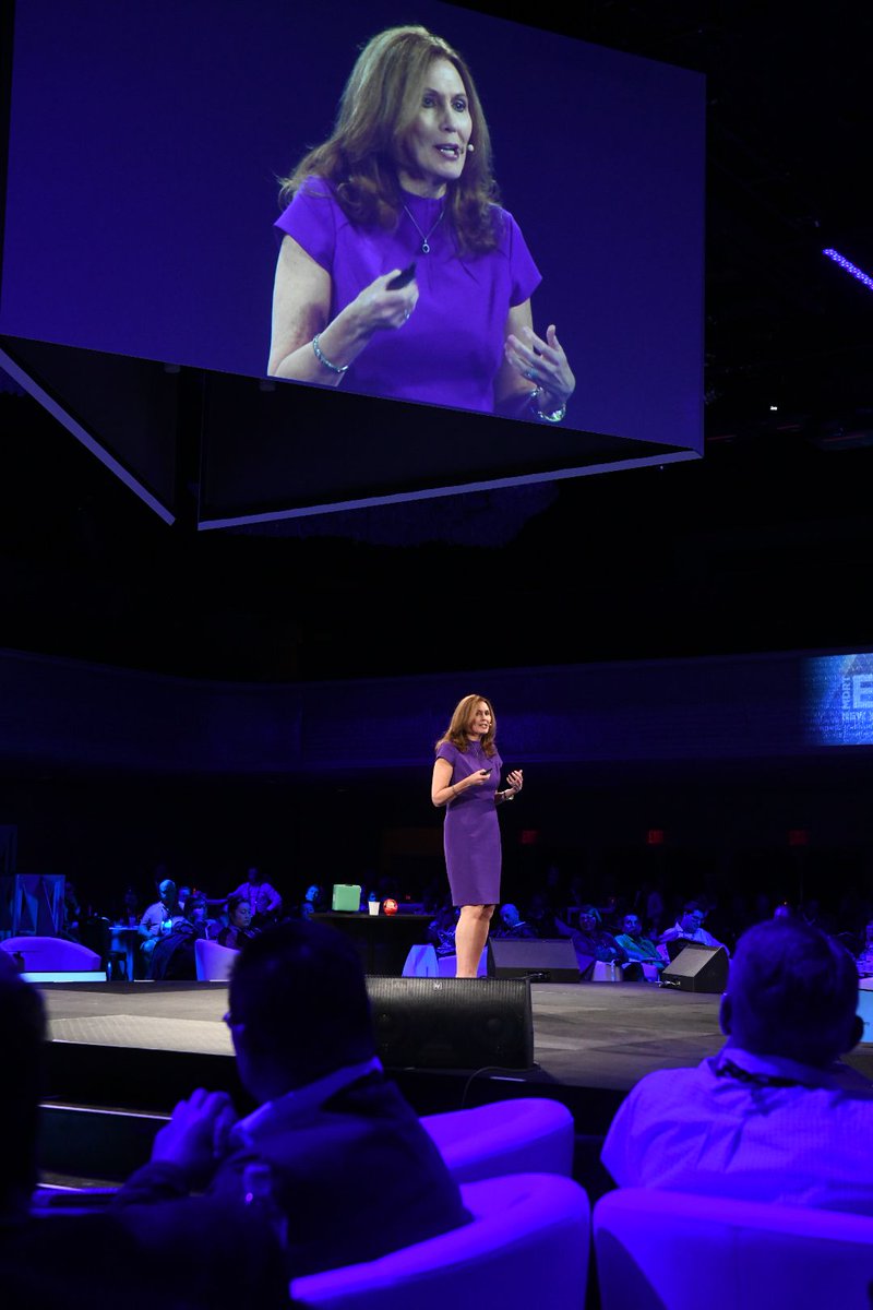 Motivational speaker, Libby Gill, on stage presenting at an event